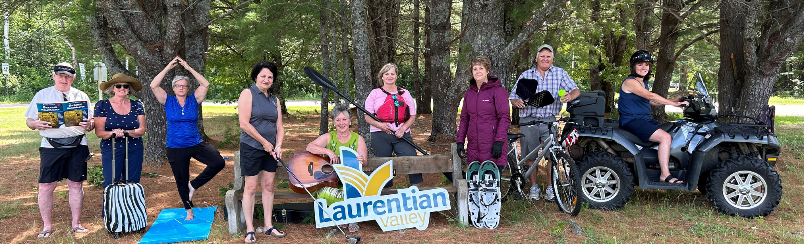Group photo of members posing with various activities.