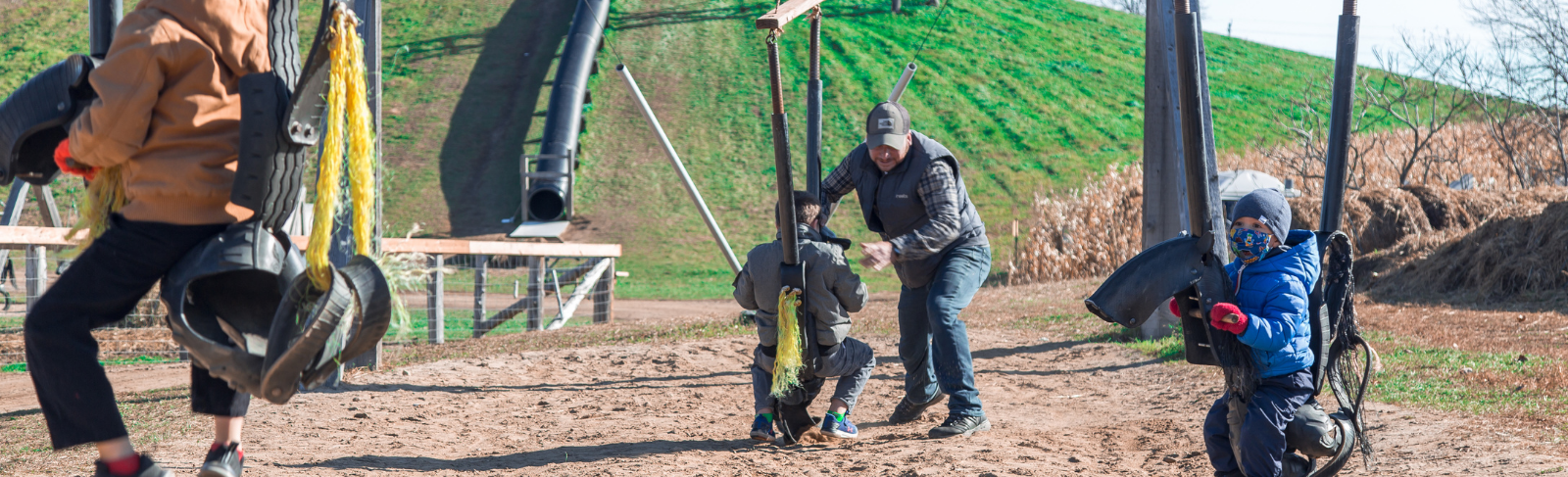 People playing at Hugli's on the play equipment.