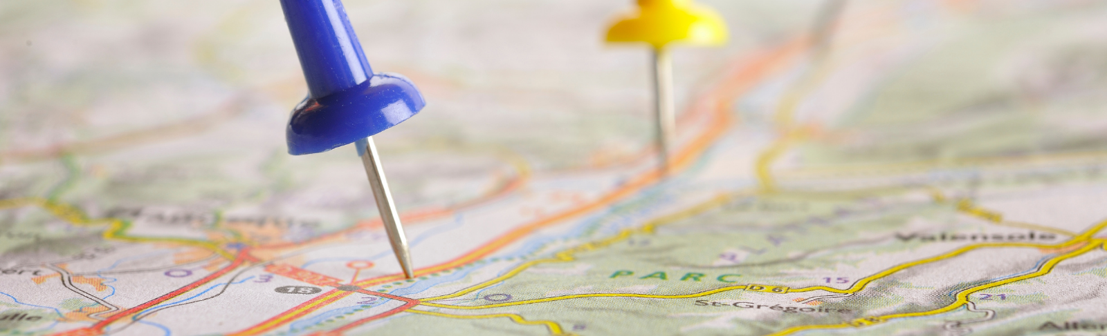 Map with push pins pointing to locations.