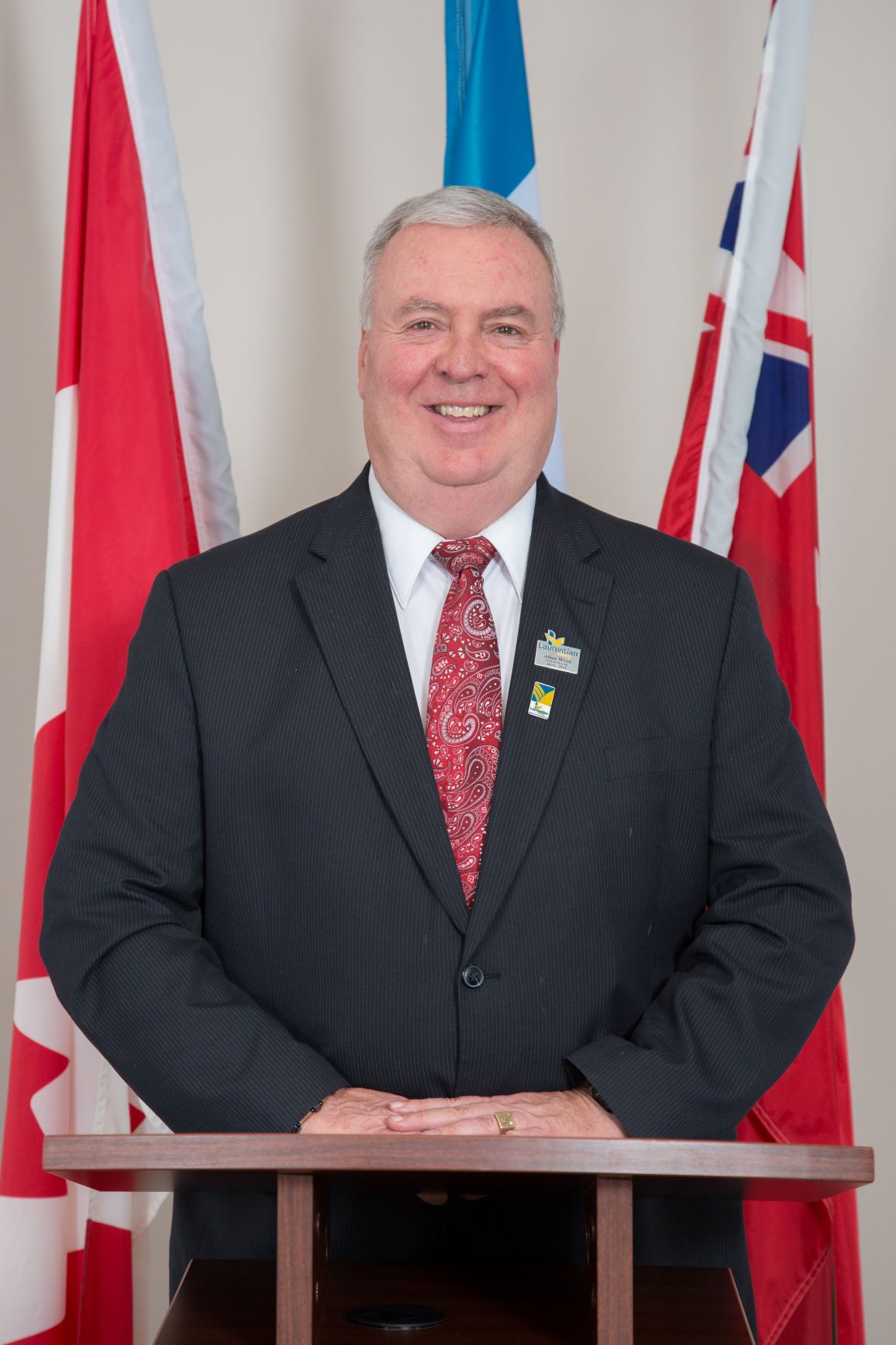 Councillor Wren behind a podium in Chambers.