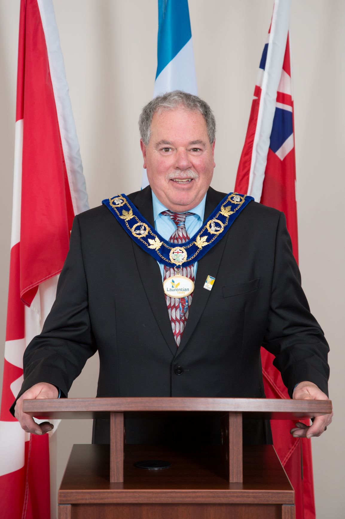 Mayor Bennett behind a podium in Chambers.