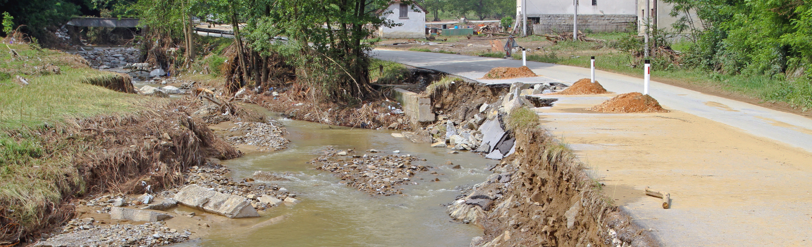 A destroyed road due to a flood.
