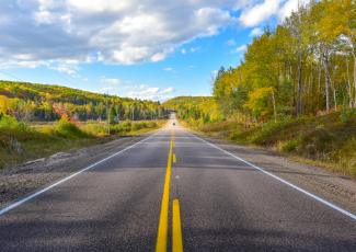 An open road in the summer time. 