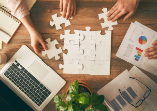 Puzzle pieces laid out on a table.