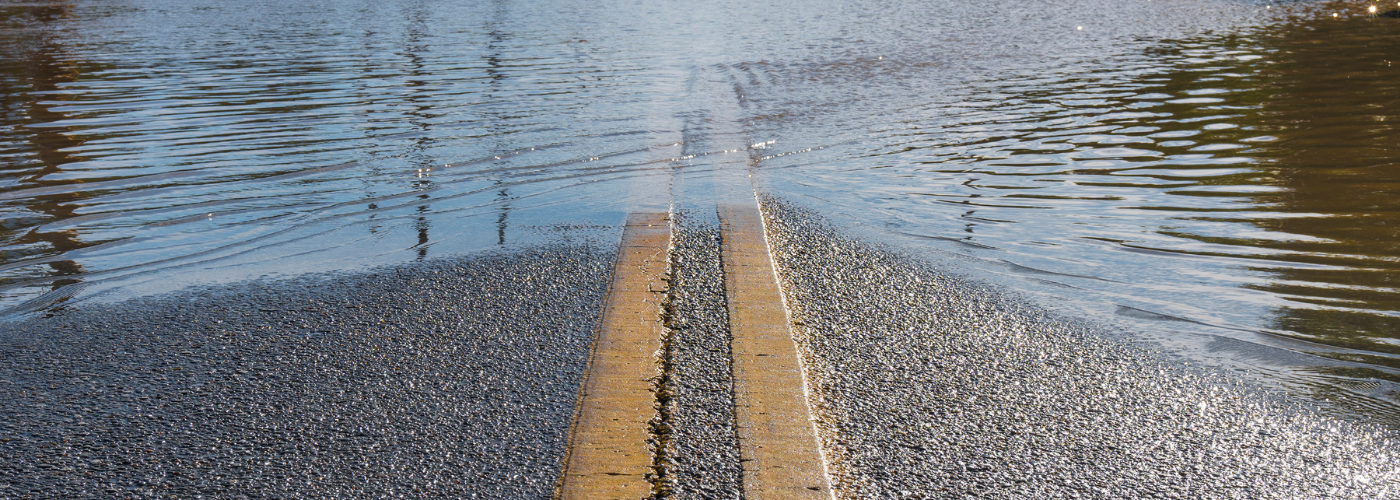 A road that is half flooded.