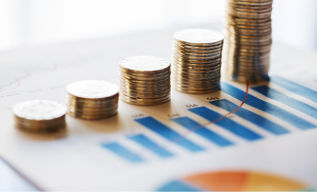 A pile of coins stacked on a graph.