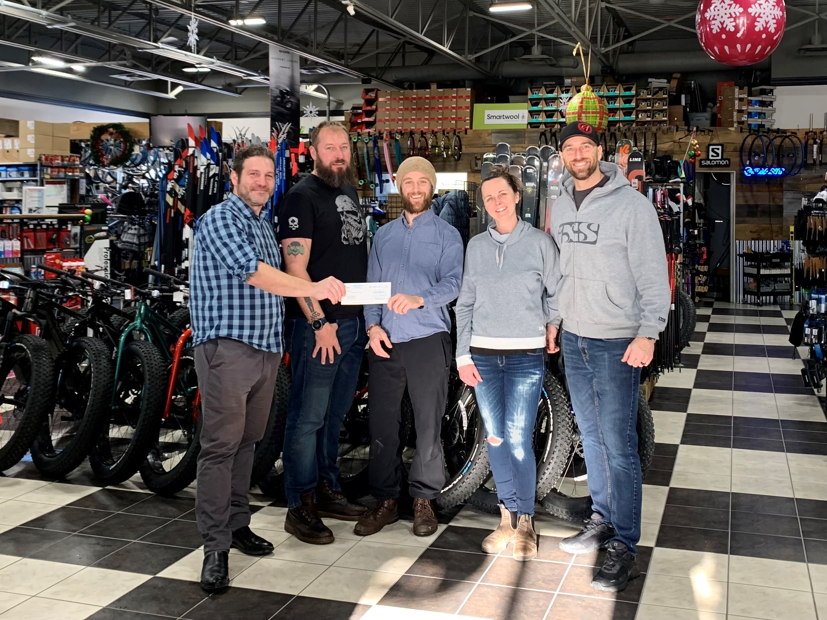 Group photo of the forest lea trail organizers with the Town of Petawawa presenting the cheque from funds raised from the Water and Dirt Festival.