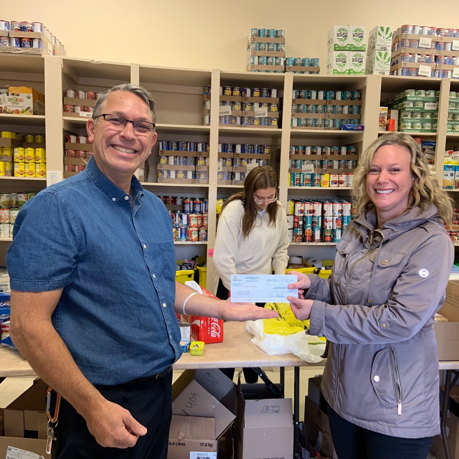 Navada Sargent presenting the cheque to St. Joseph's Food Bank.